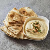 Hommous · Chick peas blended with sesame seed sauce, garlic and lemon.