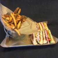 Texas Club · Ham, bacon, cheddar, lettuce and tomato on Texas toast. Served with fries.