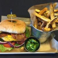 The Quarter Texas Burger · Angus burger topped with BBQ sauce, cheddar cheese and bacon. Served with a side of jalapeno...