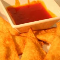 Cheese Puffs · 6 cream cheese stuffed inside a crispy wonton with sweet & sour on the side.