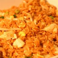 Wok Fried Rice · Stir fried rice with egg, bean sprouts, green onions, peas and carrots & your choice of prot...