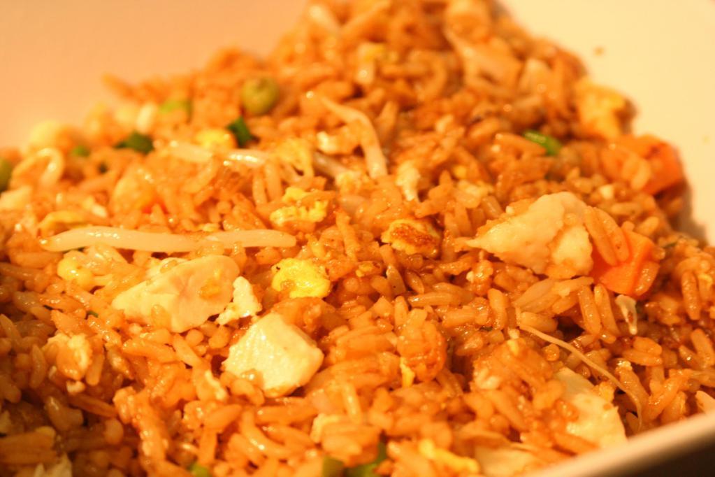Wok Fried Rice · Stir fried rice with egg, bean sprouts, green onions, peas and carrots & your choice of protein.