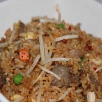 Pineapple Fried Rice · Stir-fried rice with egg, bean sprouts, green onions, peas, carrots, broccoli and pineapple....