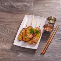 Chicken Satay · Marinated chicken flame-grilled on bamboo skewers. Served with special peanut sauce and cucu...