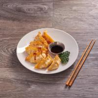 Pot Stickers · Chicken vegetable Japanese pot stickers with ginger and sweet black soy sauce.