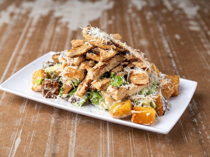 Caesar's con Pollo O Camarones Ensalada · Lettuce, parmesan cheese, croutons with grilled chicken breast or shrimps.