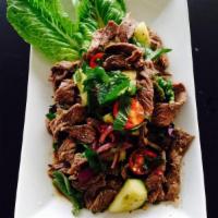 10. Num Tok (Beef Salad) · Grilled sliced beef tossed with red onion, green onion, tomato, cucumber, mint and cilantro ...