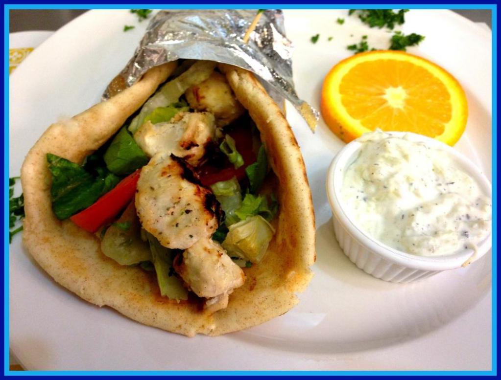 Chicken Souvlaki Kabob in Greek Pita Sandwich · Chicken cubes skewered and charbroiled. Wrapped in Greek pita bread with lettuce and tomatoes. Served with tzatziki sauce on the side.