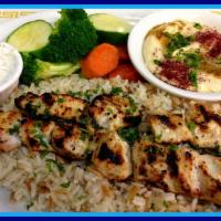 Chicken Souvlaki Plate Kabob · 2 skewers of tender marinated chicken breast charbroiled to perfection. Served on a bed of r...
