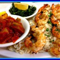 Grilled Shrimp · 2 skewers of large shrimp grilled to perfection, served on a bed of rice pilaf with briami a...