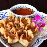 9. Crab Wonton · Deep fried wontons stuffed with crab meat and cream cheese served with our special sauce.