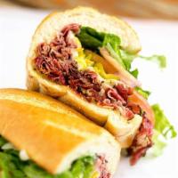Pastrami Deluxe Sandwich · Grilled pastrami, mustard, mayonnaise, provolone cheese, lettuce, tomatoes, red onions, pick...
