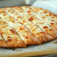Cheese Bread · A favorite throughout! Our dough rolled and covered with garlic butter spread and mozzarella...