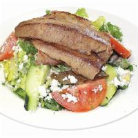 22. Gyros Salad · Gyros on house salad. Served with pita bread. Halal.