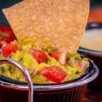 Homemade Guacamole · Fresh avocados with pico, lime juice and salt with crispy tortillas chips.