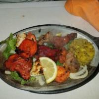 Mix Grill · A combination of our appetizing tandoori chicken, chicken tikka, malai kabab, boti kabab, sh...
