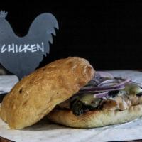 Chicken Poblano Sandwich · Served with poblano peppers, red onions, melted jack cheese and jalapeno ranch dressing on c...
