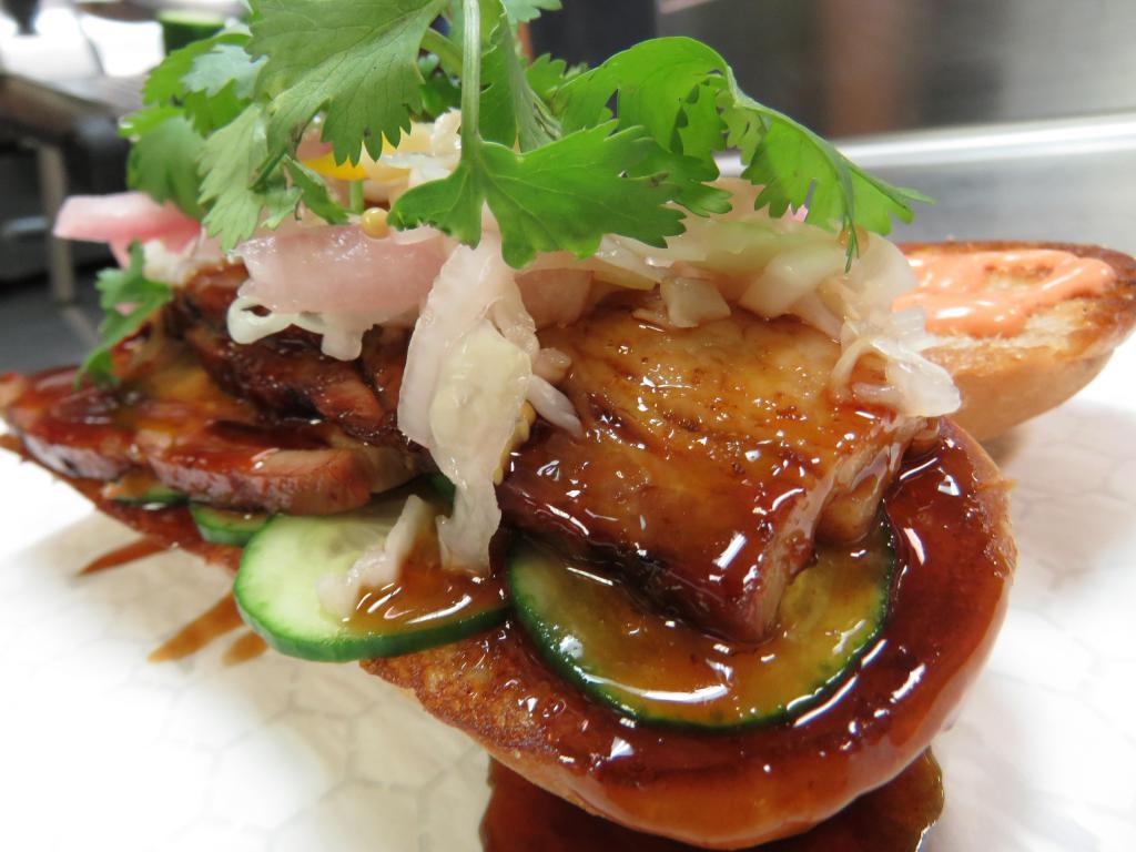 Pork Belly Sandwich · Served with cucumber, cilantro, vinegar slaw, sriracha mayo and one90 house sauce.