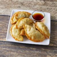 Fried Dumplings · filled with beef, pork, and vegetables.