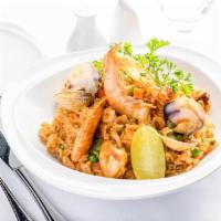 Arroz del Pacifico Sur · Peruvian-style paella. Infused rice in Peruvian pepper sauce with calamari, clams, shrimp, a...
