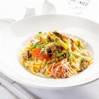 Fettuccine del Chef · Sauteed garlic veggies, served on top of a bed of fettuccine, mixed with our homemade creamy...