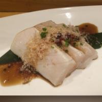 Escolar with Crunchy Soy Sesame Bits · Yuzu wasabi dressing, chives and tuna flakes.
