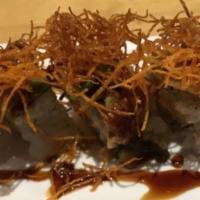Sweet Eel Maki · Fried sweet potato, avocado topped with eel and unagi sauce with tempura flakes.