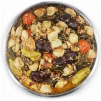 Dolma 1lb  · Onions and grape leaves or cabbage leaves cooked with a filling of ground meat, rice, and di...