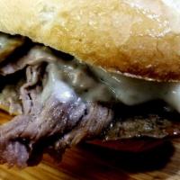 Philly Steak and Cheese Hot Sandwich · Served with grilled onions and mushrooms baguette with tangy Swiss cheese.