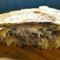 Beef Reuben Hot Sandwich · In house roasted top round beef, 1000 island dressing, sauerkraut, tangy Swiss cheese and ry...