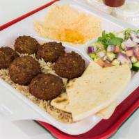 Falafel Over Rice Platter · Served with mixed salad and choice of fries and hummus.