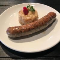 Kielbasa · Delicious Polish smoked sausage, grilled & served with a side of sauerkraut stew & potato sa...