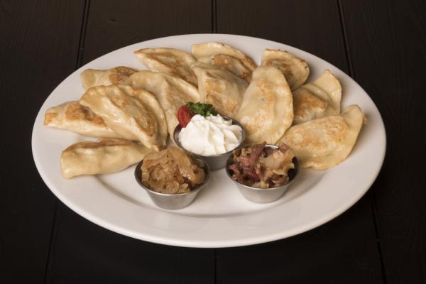 6 Sweet Pierogi Plate · Pierogi made from high gluten flour, eggs, sour cream.  Served boiled, covered with powdered sugar and caramel.