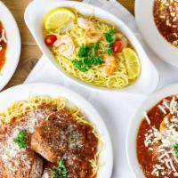 Veal Parmesan and Spaghetti Dinner · Served with garlic bread.