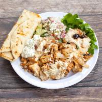 Chicken Shawarma Plate · All plates come with your choice of hummus or baba ghanoust, white rice, Greek salad, Tzatzi...