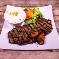 Carne Asada · Grilled sirloin steak. Served with rice, salad and sweet plantain. Add $1.00 change to fried...
