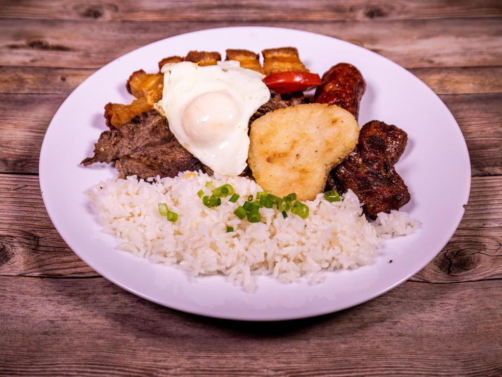 Bandeja Paisa · Served with beef steak, rice, beans, fried sweet plantains, deep fried pork rind, one fried egg, corn patty, chorizo and avocado. Add $1.00 to change to fried green plantain.