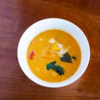 Pumpkin Red Curry · Fresh pumpkin chunk in a classic red curry, red bell pepper and basil.