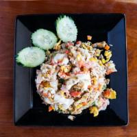 Crab Fried Rice · Thai fried rice with real crab meat and imitated crab meat, egg, tomato, onion and pea carrot.