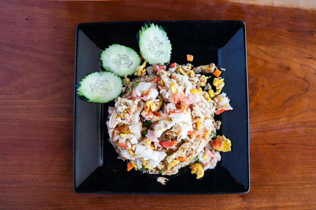 Crab Fried Rice · Thai fried rice with real crab meat and imitated crab meat, egg, tomato, onion and pea carrot.