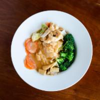 Lava Noodle · Steamed wide rice noodle with broccoli, baby corn, carrot, cabbage, and mushroom topped with...