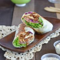 Chicken Shawerma Sandwich · Shaved slices of marinated chicken grilled on a vertical spit served on a toasted wrap or fl...