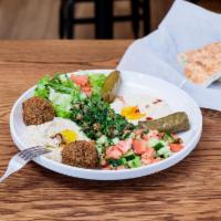 Maza Platter Deluxe · Falafel + hummus + baba ghanoush + fat-free baba ghanoush + stuffed grape leaves + tabbouleh...