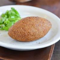 Kibbie · ground beef, onions and spices covered in shell of ground beef and cracked wheat- fried to p...