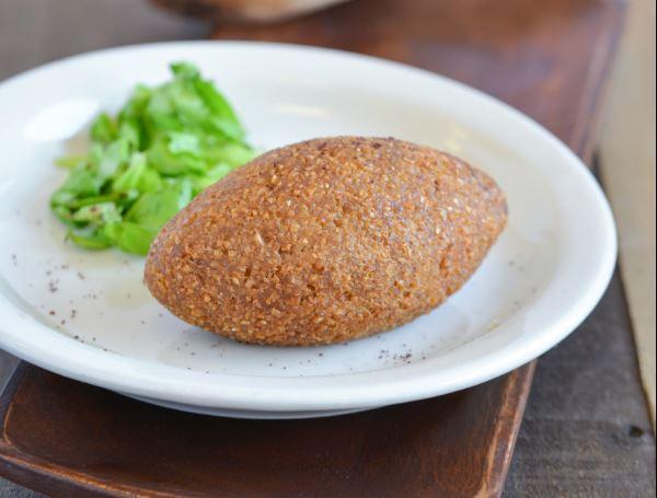 Meat Kibbie · ground beef, onions and spices covered in shell of ground beef and cracked wheat- fried to perfection 