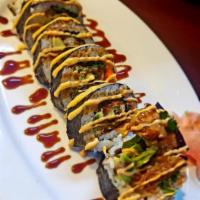 6 Piece Spider Roll · Fried soft shell crab, avocado, cucumber, lettuce, masago topped with spicy mayo and eel sau...