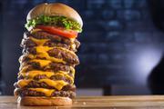 The 9 Patty Burger · 9 (That's Right, 9) fresh, 100% all beef patties, 9 slices of American cheese, lettuce and t...