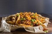 Chili Cheese Fries · Our traditional french fries topped with chili, cheddar Jack cheese and fresh scallions.
