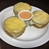 Res Rellenos · Fried mashed plantain cups, stuffed with ground beef, topped with melted mozzarella cheese