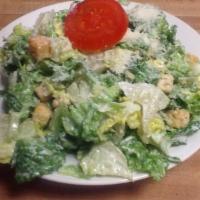 Caesar Salad · Chopped fresh lettuce with our delicious Caesar dressing mixed with seasoned croutons, Roman...